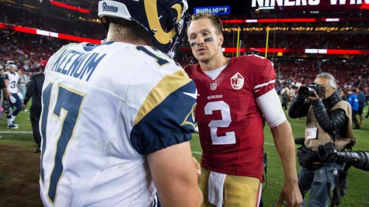 Quarterbacks Blaine Gabbert, right, and Case Keenum after meet after Gabbert led the 49ers to a 28-0 win over the Los Angeles Rams on Sept. 12, 2016 in Santa Clara.