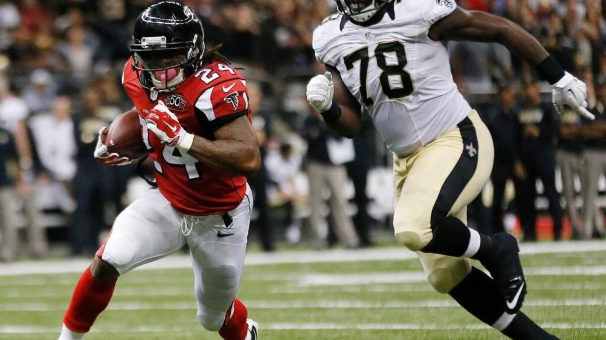 Atlanta Falcons running back Devonta Freeman leads the NFL in rushing. Though he’s only 5-foot-8, he’s averaging 4.7 yards per carry and has rushed for nine touchdown. Here Freeman is on his way to a touchdown as New Orleans Saints defensive end Bobby Richardson (78) pursues in vain during an NFL football game, Thursday, Oct. 15, 2015, in New Orleans.