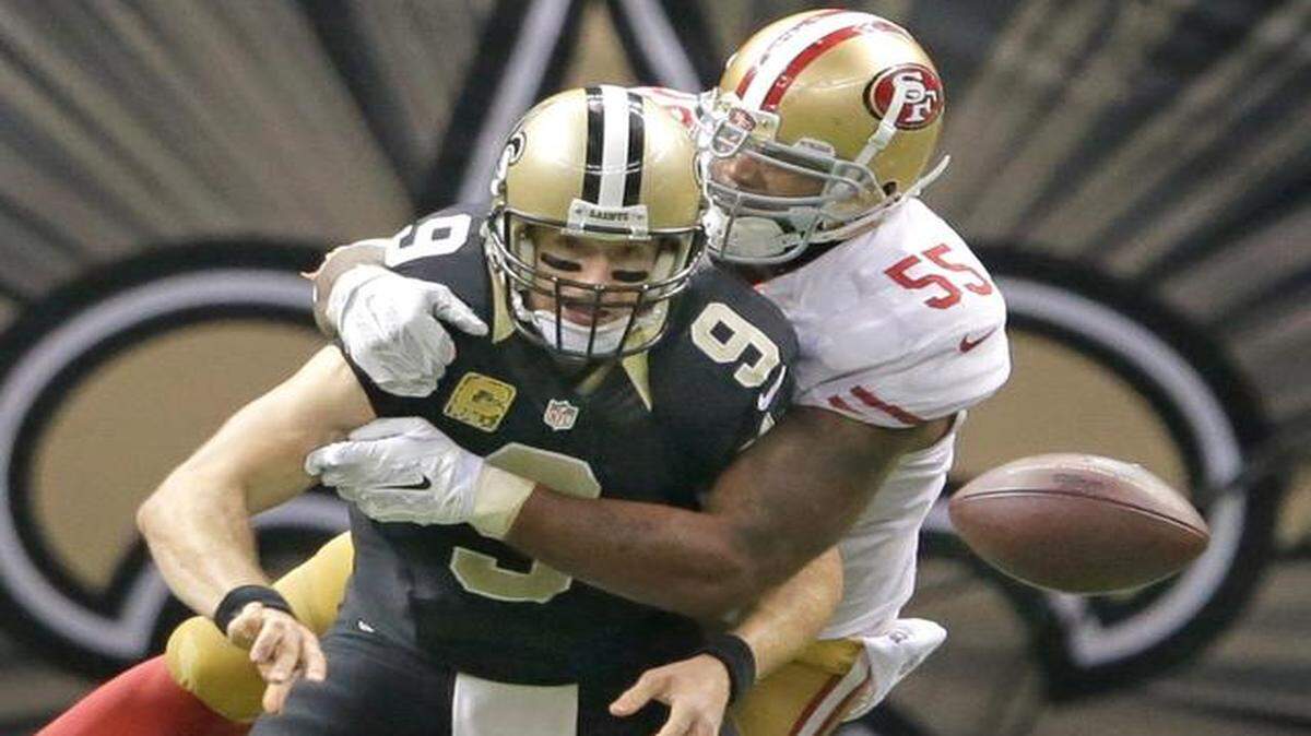 
49ers linebacker Ahmad Brooks (55), tackling New Orleans Saints quarterback Drew Brees during a game on Nov. 9, has apologized for his actions during Sunday’s game with the New York Giants.
