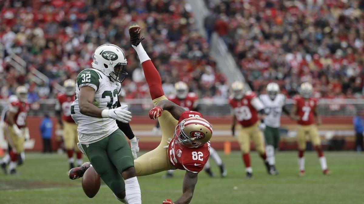San Francisco 49ers wide receiver Torrey Smith (82) is knocked down while being defended by New York Jets cornerback Juston Burris (32) on Dec. 11, 2016. Smith suffered a concussion in that game and will miss the rest of the season.