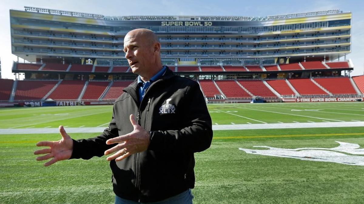 NFL Field Director Ed Mangan gestures while speaking to reporters about field preparation for the Super Bowl 50 NFL football game on Tuesday, Jan. 26, 2016, at Levi Stadium in Santa Clara, Calif.