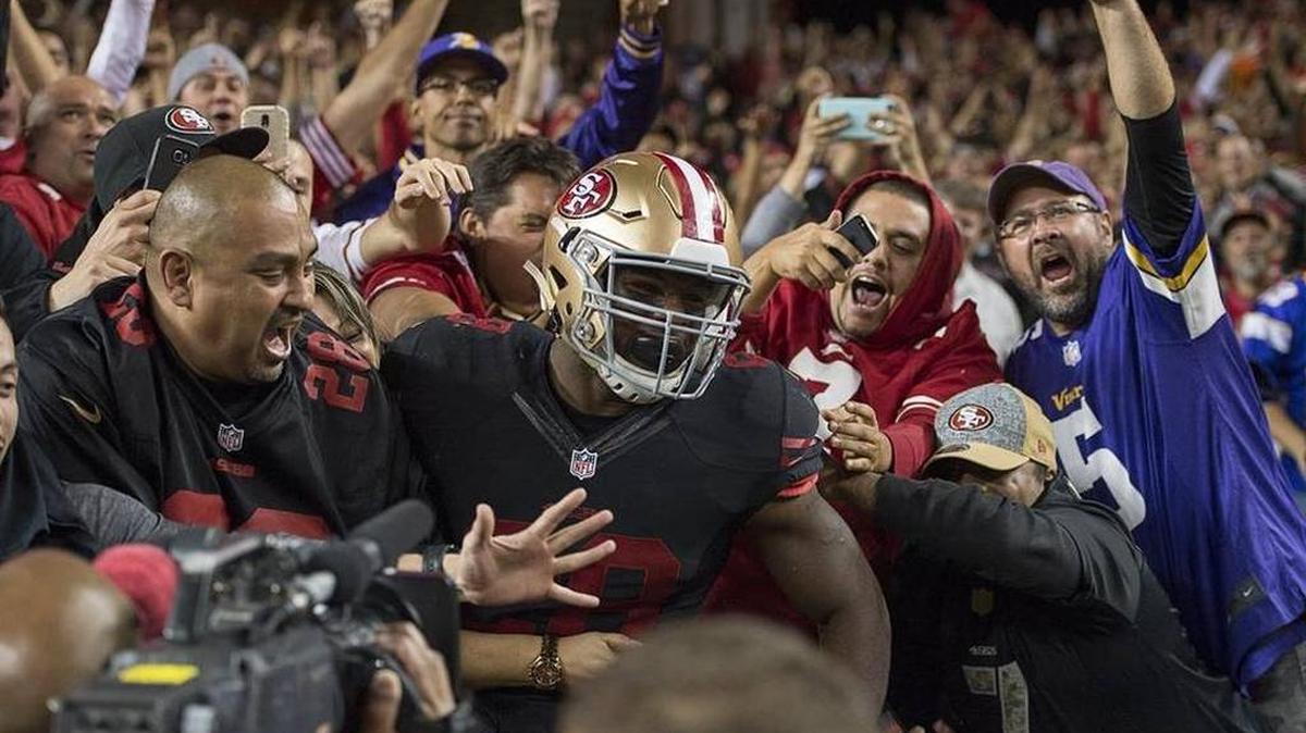 
49ers running back Carlos Hyde leaps into the first row at Levi’s Stadium following a Week 1 touchdown.
