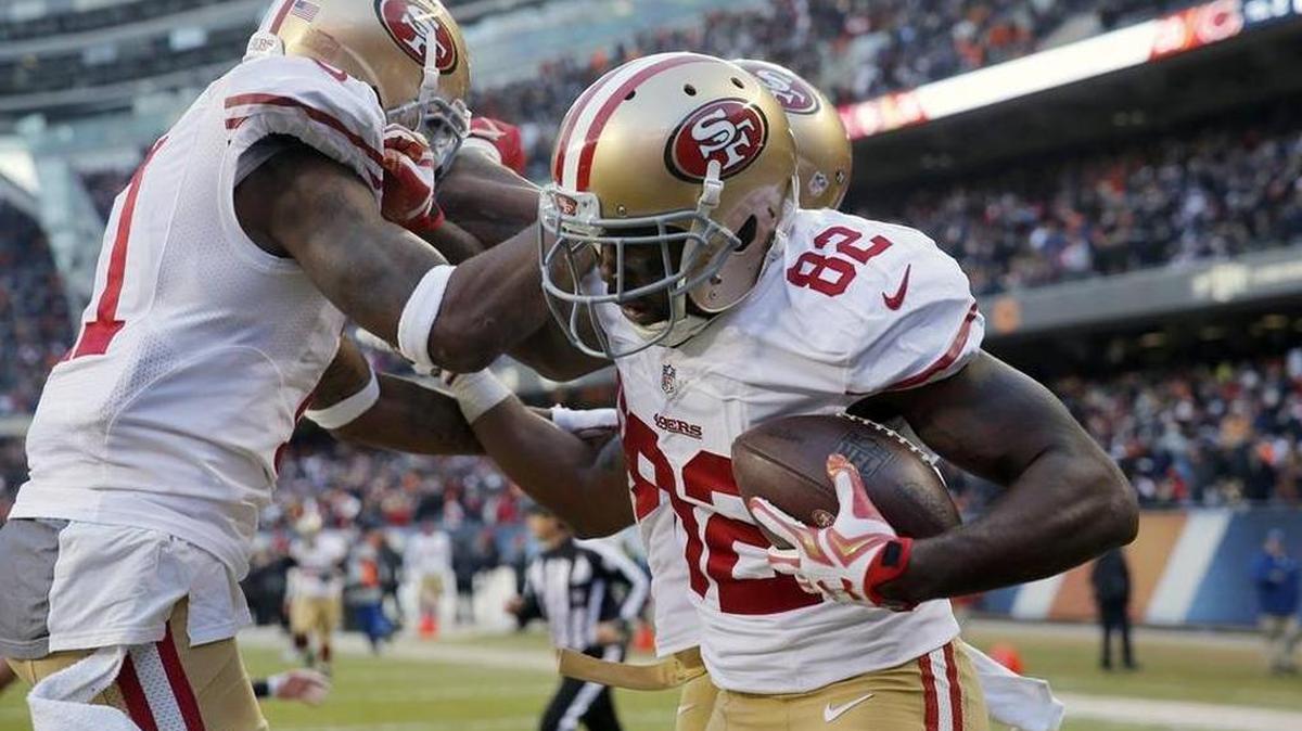 49ers receiver celebrates after catching a game-winning touchdown in Chicago last year.