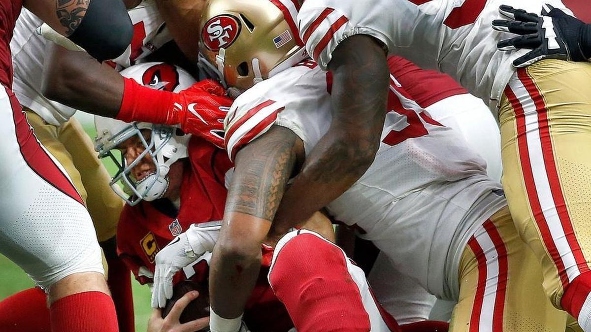Arizona Cardinals quarterback Carson Palmer (3) is sacked by San Francisco 49ers defensive tackle DeForest Buckner as linebacker Dekoda Watson (97) pursues during the second half of an NFL football game, Sunday, Oct. 1, 2017, in Glendale, Ariz.