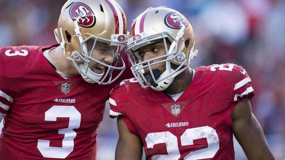 Rookies C.J. Beathard and Matt Breida celbrate after Breida’s 33-yard touchdown run in the fourth quarter.