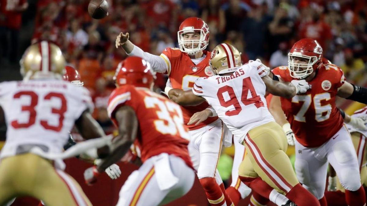 Kansas City Chiefs quarterback Tyler Bray (9) throws under pressure from San Francisco 49ers defensive lineman Solomon Thomas (94) during the first half of an NFL preseason football game in Kansas City, Mo., Friday, Aug. 11, 2017.