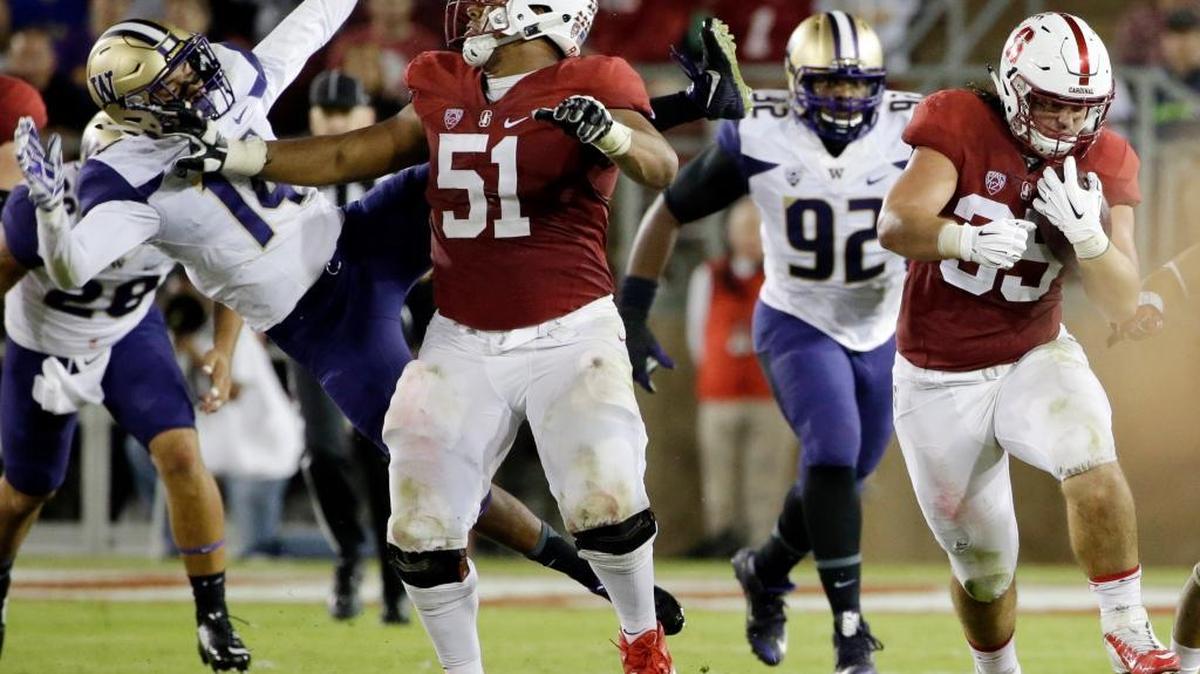 Joshua Garnett (51), shown blocking for then-Stanford teammate Daniel Marx (35), has been unable to join his 49ers teammates at practice because Stanford’s academic year is still in session.