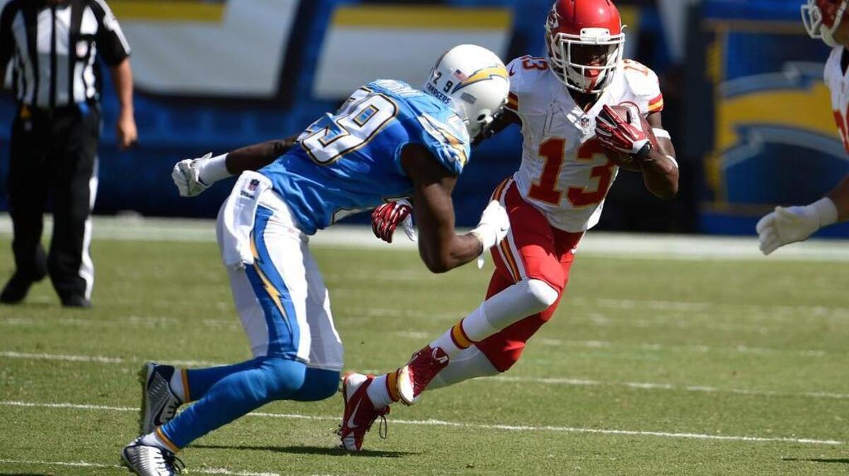 
Former San Diego Chargers cornerback Shareece Wright, left, pursues De’Anthony Thomas of the Kansas City Chiefs in a game last season.
