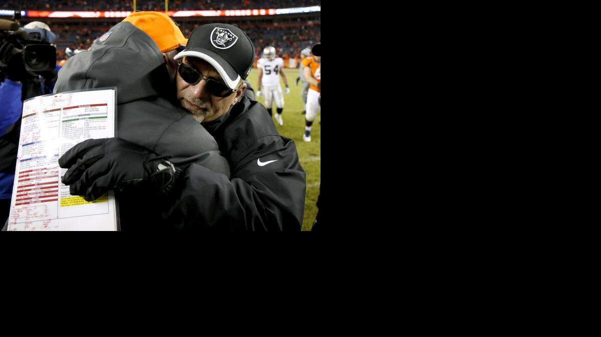 
Denver Broncos head coach John Fox and Oakland Raiders head coach Tony Sparano, right, greet after an NFL football game, Sunday, Dec. 28, 2014, in Denver.
