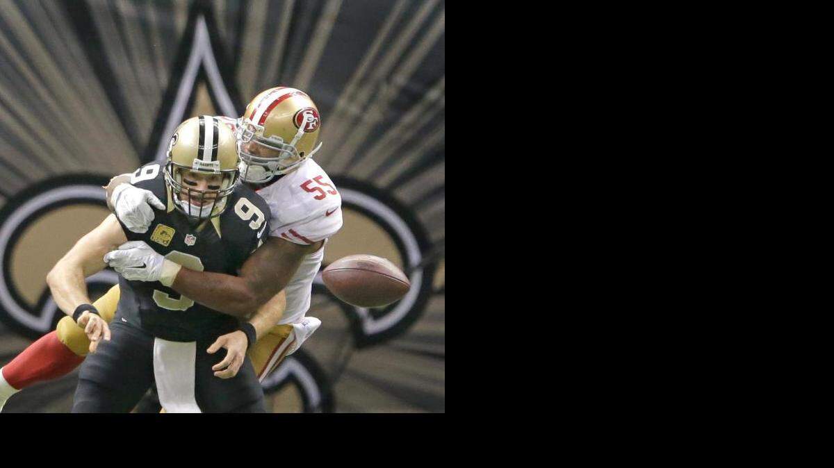 
Ahmad Brooks knocks the ball from Saints quarterback Drew Brees on the game’s most pivotal play.
