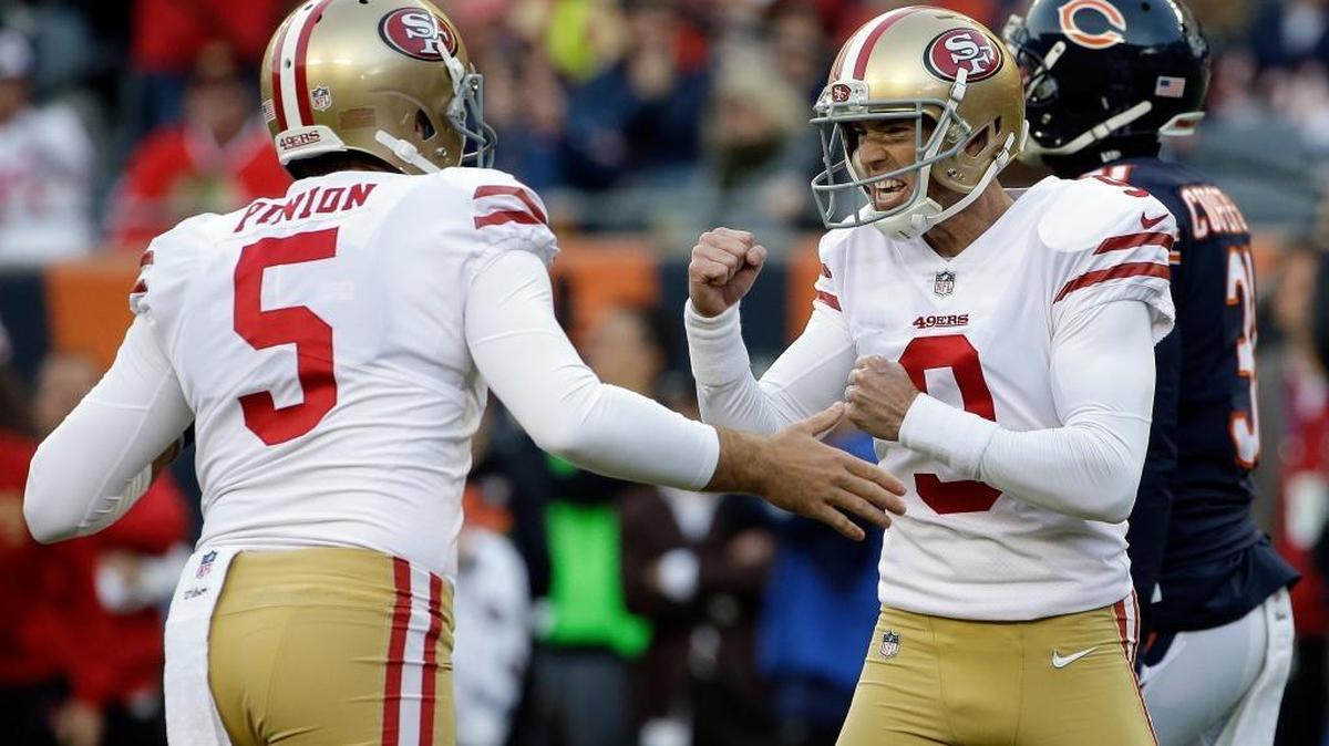 San Francisco 49ers kicker Robbie Gould (9) celebrates with punter Bradley Pinion (5) after kicking a game winning field goal during the second half of an NFL football game against the Chicago Bears, Sunday, Dec. 3, 2017, in Chicago. The 49ers won 15-14.