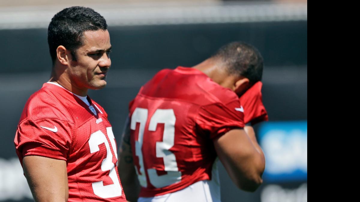 
San Francisco 49ers running back Jarryd Hayne, left, rests between drills during an NFL football minicamp Wednesday, April 29, 2015, in Santa Clara, Calif. 
