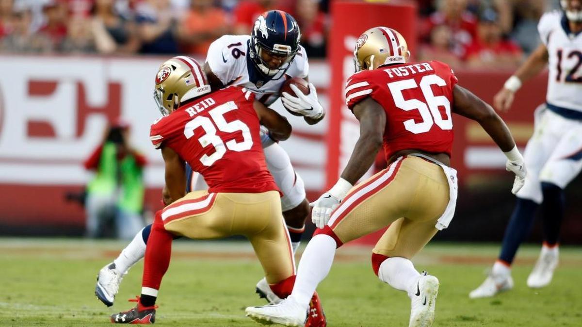 Eric Reid (35) and Reuben Foster (56) tackle Denver Broncos wide receiver Bennie Fowler III on Saturday at Levi’s Stadium in Santa Clara. The 49ers lost 33-14.