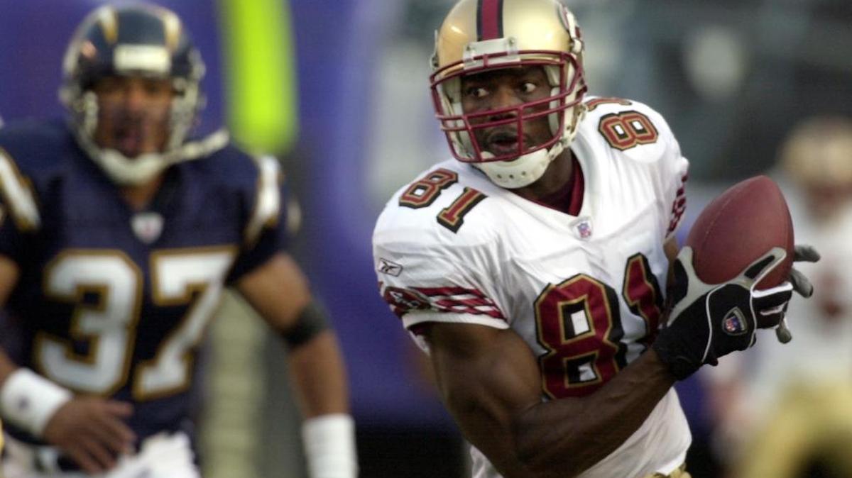 San Francisco 49ers' Terrell Owens out runs San Diego Chargers safety Rodney Harrison with a 76 yard touchdown pass in the third quarter of their game Sunday Nov. 17, 2002 in San Diego.