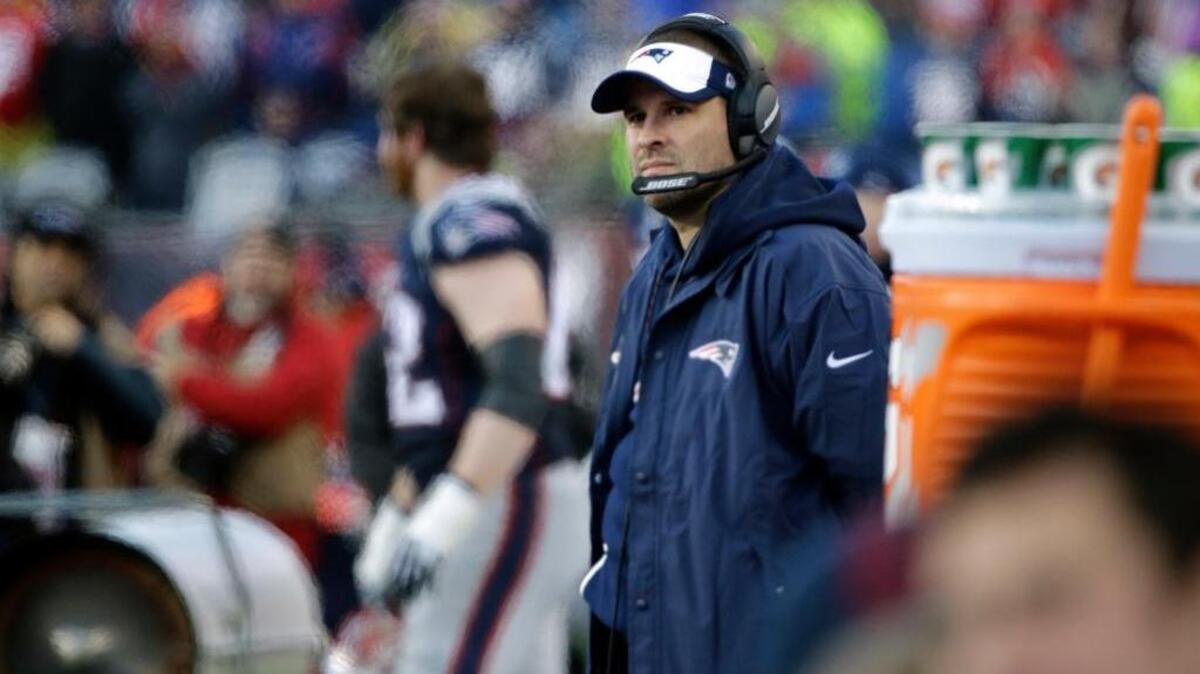 New England Patriots offensive coordinator Josh McDaniels watches from the sideline during the second half of an NFL football game against the New York Jets, Saturday, Dec. 24, 2016, in Foxborough, Mass.