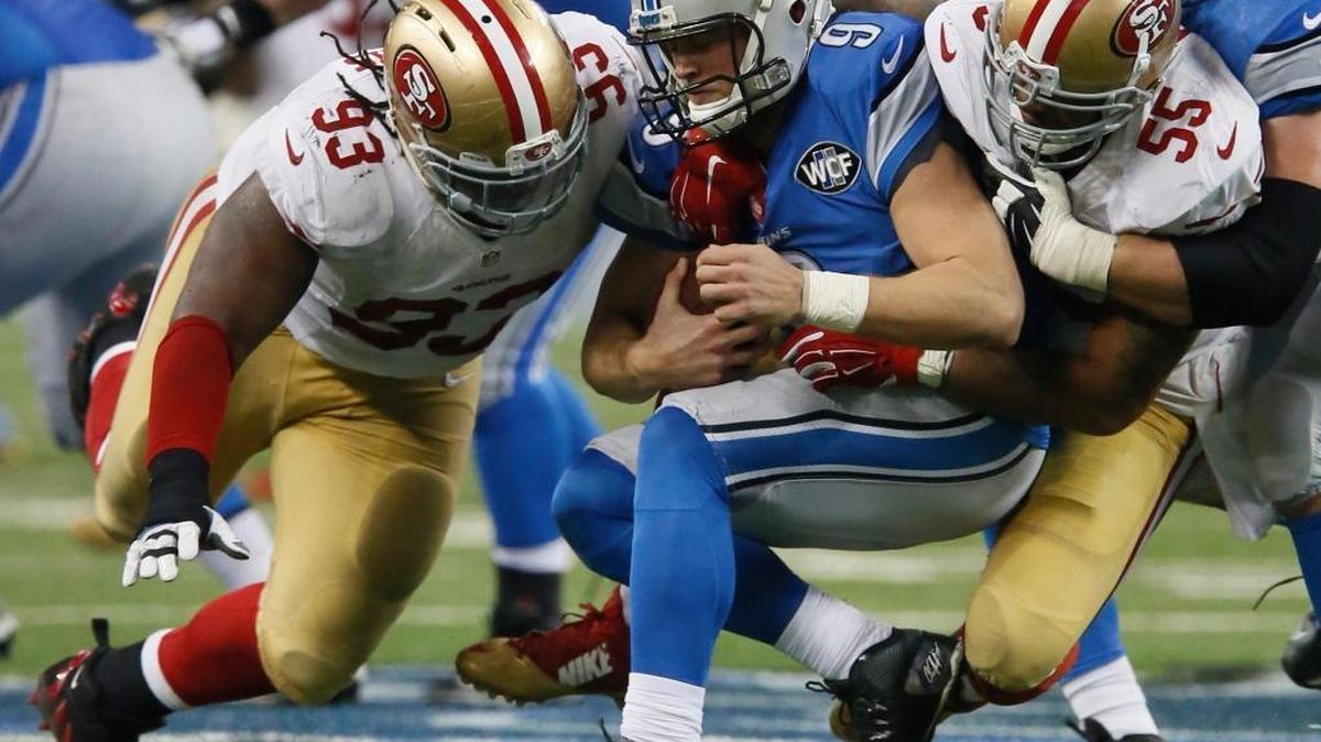Detroit Lions quarterback Matthew Stafford (9) is sacked by San Francisco 49ers outside linebacker Ahmad Brooks (55) as nose tackle Ian Williams (93) assists during the second half of an NFL football game, Sunday, Dec. 27, 2015, in Detroit.
