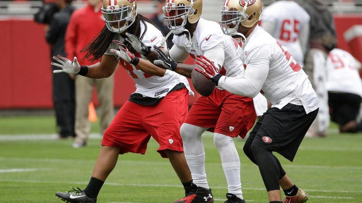 
San Francisco 49ers linebackers Philip Wheeler, from left, NaVorro Bowman and Michael Wilhoite practice during an NFL football mini-camp in Santa Clara, June 10. 

