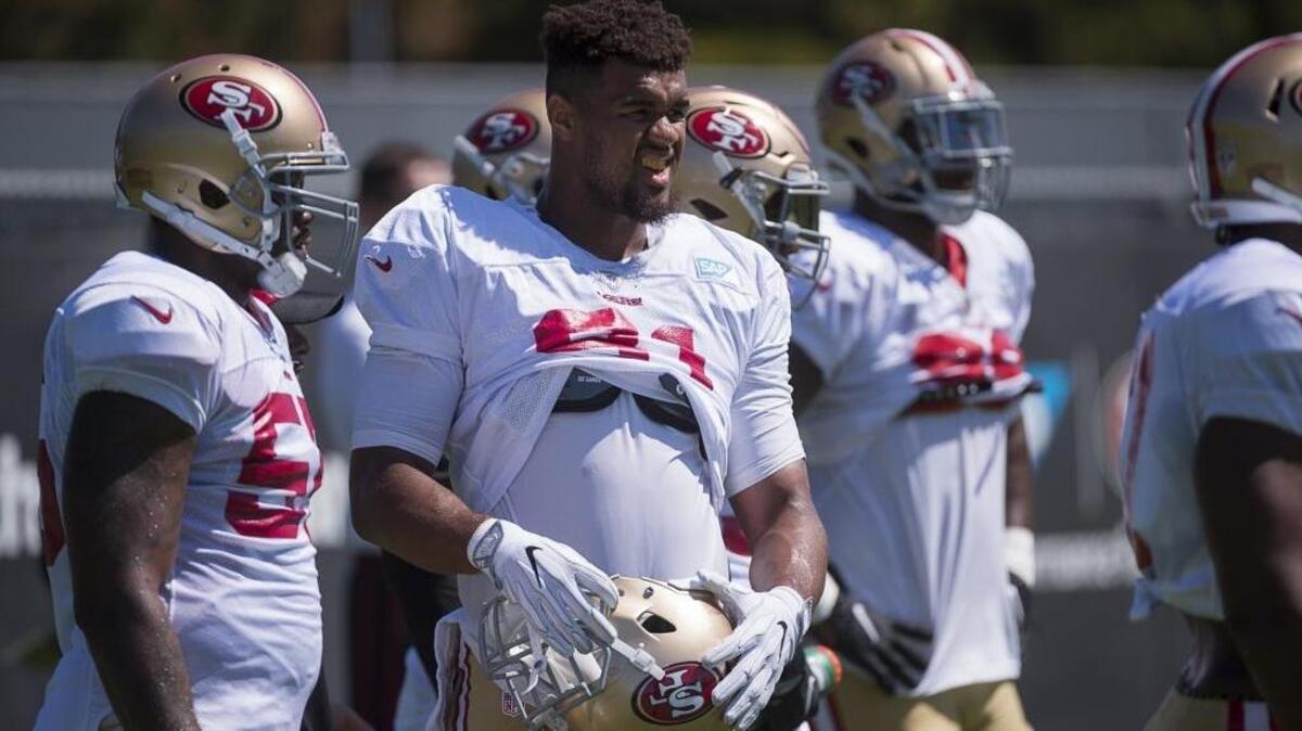 Arik Armstead, middle, reported to training camp at less than 275 pounds, the lightest he’s been since his junior year at Pleasant Grove High School.