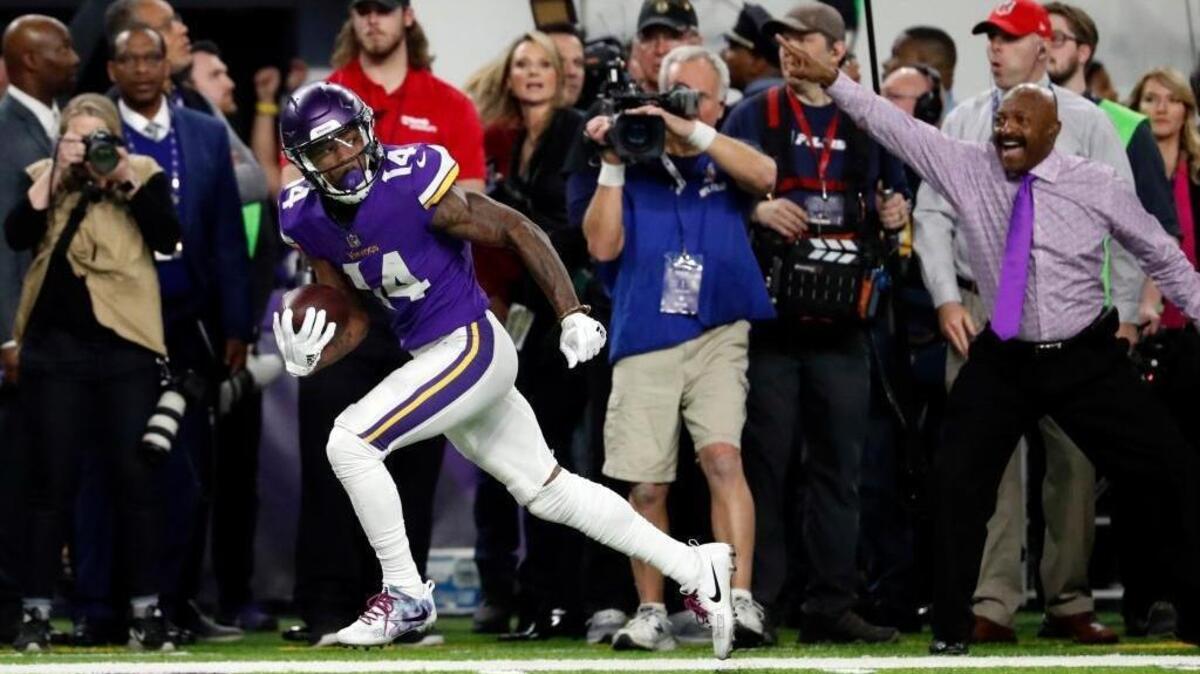 In this Sunday, Jan. 14, 2018, file photo, Minnesota Vikings wide receiver Stefon Diggs (14) looks back as he runs down the sideline for the game-winning touchdown Saints late in the second half of an NFL divisional football playoff game against the New Orleans in Minneapolis. The Vikings defeated the Saints 29-24.