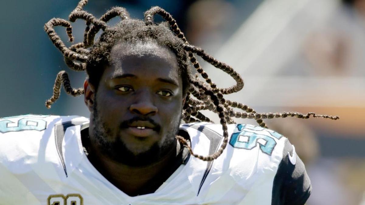Jacksonville Jaguars defensive tackle Sen'Derrick Marks (99) runs out of the tunnel before the start of the first half of an NFL football game against the Indianapolis Colts in Jacksonville, Fla., Sunday, Sept. 21, 2014. The Colts beat the Jaguars 44-17.