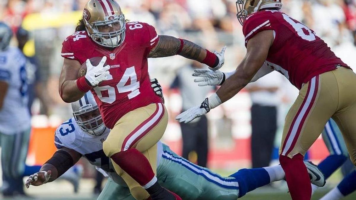 Lineman Mike Purcell rumbles into the end zone following an interception in a preseason game between the 49ers and Cowboys.