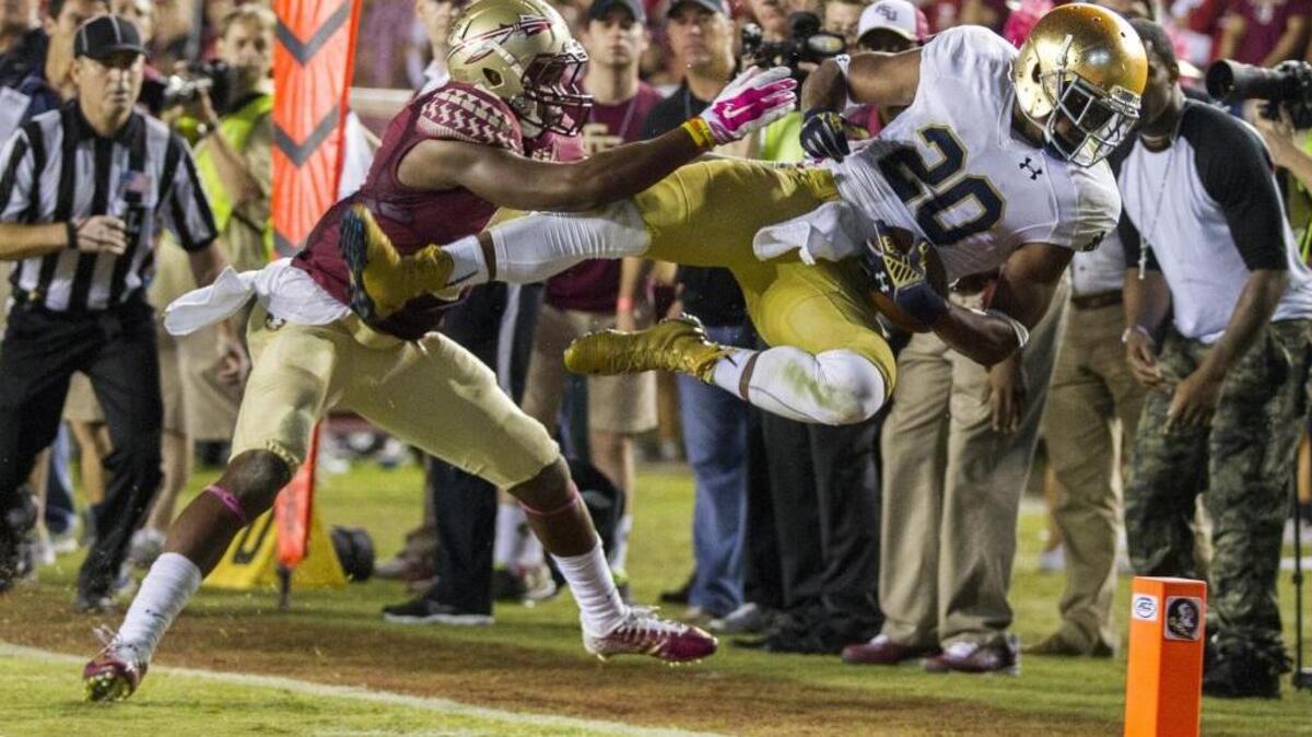 Florida State defensive back Jalen Ramsey, left, stops Notre Dame wide receiver C.J. Prosise short of the goal at the end of an NCAA college football game in Tallahassee, Fla., Saturday, Oct. 18, 2014. Florida State won 31-27.