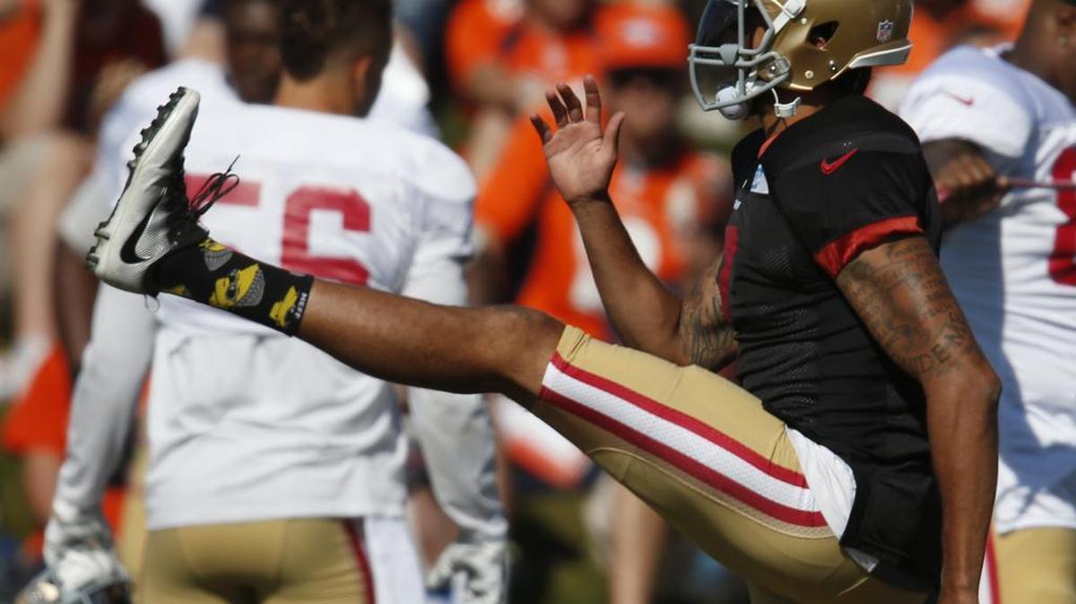 San Francisco 49ers quarterback Colin Kaepernick kicks his leg as he warms up before facing the Denver Broncos during drills at the teams' joint NFL football training camp Wednesday, Aug. 17, 2016 in Englewood, Colo. The Broncos host San Francisco on Saturday in an NFL exhibition football contest.