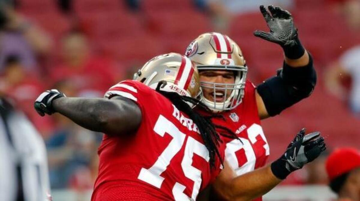 San Francisco 49ers offensive tackle Darrell Williams (75) celebrates with teammate Chris Jones during the first half of a preseason NFL football game against the Los Angeles Chargers Thursday, Aug. 31, 2017, in Santa Clara, Calif.