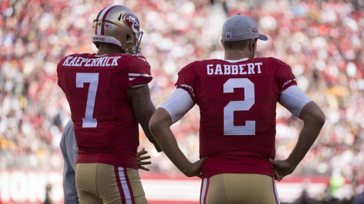 49ers quarterbacks Colin Kaepernick (7) and Blaine Gabbert (2) stand near the team bench during a timeout in the fourth quarter of an NFL game between the 49ers and Green Bay on October 4, 2015 at Levi’s Stadium in Santa Clara, Calif.