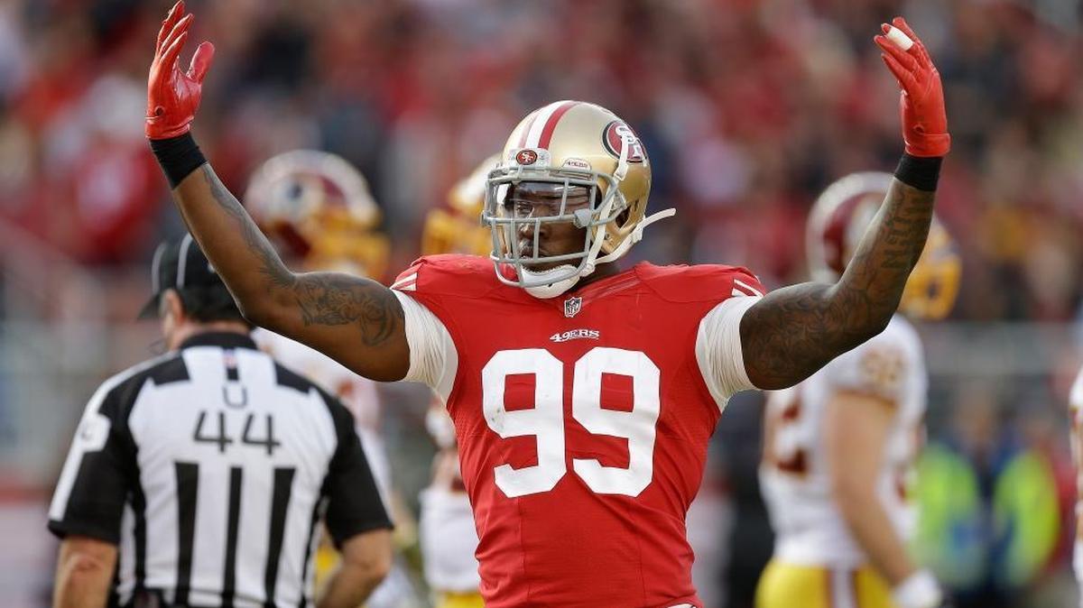 
Aldon Smith celebrates in a 2014 game with the 49ers. Smith, who was cut by the 49ers, signed a one-year deal with Oakland on Friday.


