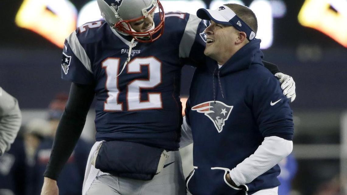 New England Patriots quarterback Tom Brady (12) and offensive coordinator Josh McDaniels walk together during warm-ups before an NFL divisional playoff football game against the Houston Texans, Saturday, Jan. 14, 2017, in Foxborough, Mass.
