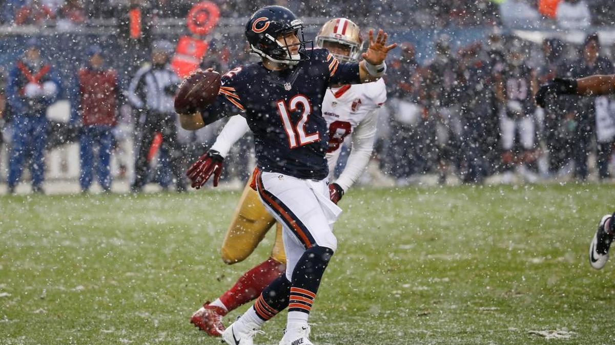 Chicago Bears quarterback Matt Barkley (12) throws a pass against San Francisco 49ers defensive end DeForest Buckner (99) during the second half of an NFL football game, Sunday, Dec. 4, 2016, in Chicago.