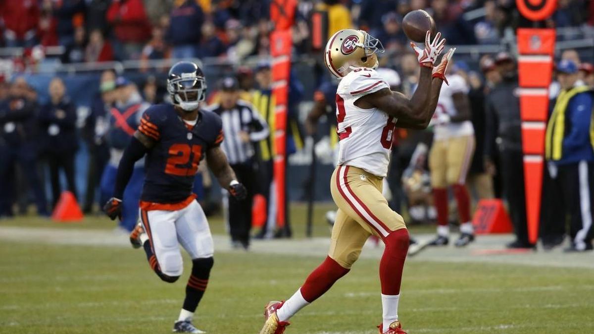 San Francisco 49ers wide receiver Torrey Smith (82) makes a game-winning touchdown catch during the overtime of an NFL football game against the Chicago Bears, Sunday, Dec. 6, 2015, in Chicago.