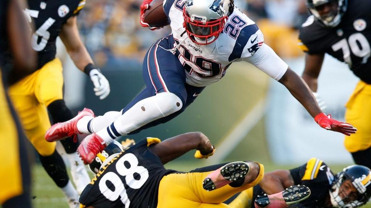 New England Patriots running back LeGarrette Blount (29) is upended by Pittsburgh Steelers inside linebacker Vince Williams (98) during the first half of an NFL football game in Pittsburgh, Sunday, Oct. 23, 2016.