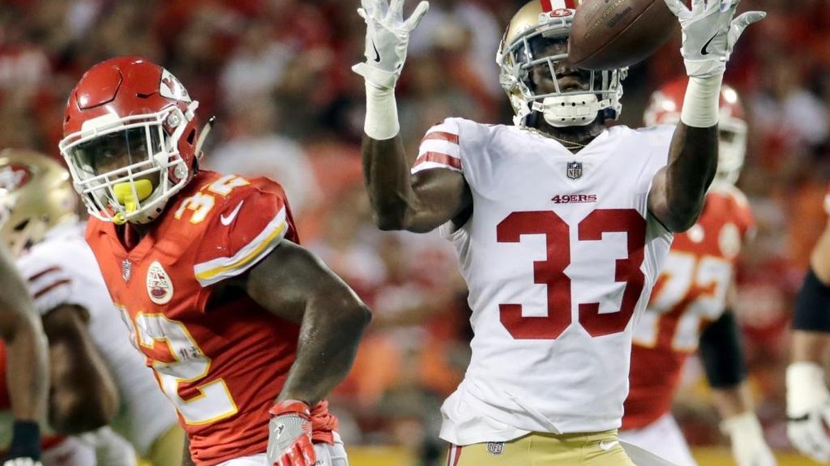 San Francisco 49ers cornerback Rashard Robinson (33) intercepts a pass by Kansas City Chiefs quarterback Tyler Bray (9), with running back Spencer Ware (32) looking, during the first half of an NFL preseason football game in Kansas City, Mo., Friday, Aug. 11, 2017.
