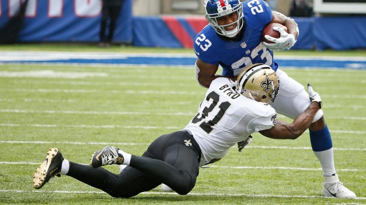New Orleans Saints' Jairus Byrd (31) tackles New York Giants' Rashad Jennings (23) during the first half of an NFL football game Sunday, Sept. 18, 2016, in East Rutherford, N.J.