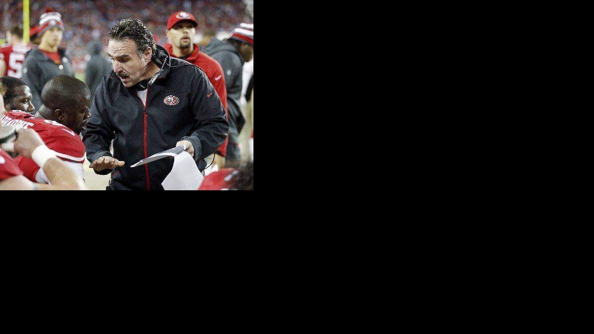 
Jim Tomsula tried to find assistant coaches whose personalities would would mesh. He’s seen here working with defensive end Tank Carradine.
