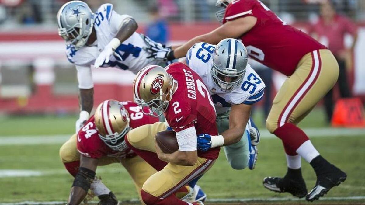 
49ers quarterback Blaine Gabbert was sacked for a five-yard loss in the second quarter of Sunday’s win over the Cowboys
