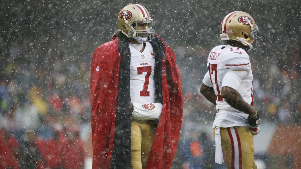 San Francisco 49ers quarterback Colin Kaepernick (7) stands on the sidelines during the first half of an NFL football game against the Chicago Bears Sunday, Dec. 4, 2016, in Chicago.