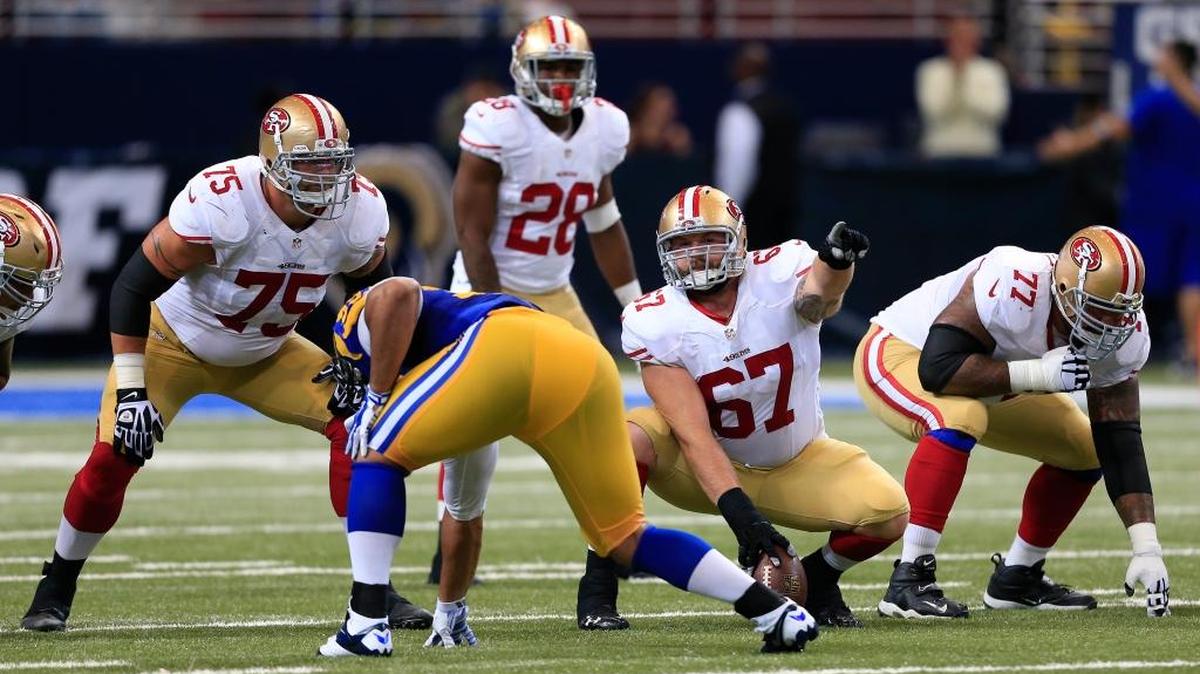 San Francisco 49ers center Daniel Kilgore (67) gets ready to snap the ball against the St. Louis Rams in the third quarter of an NFL football game Monday, Oct. 13, 2014, in St Louis.