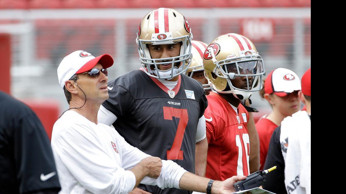 
San Francisco 49ers quarterback Colin Kaepernick (7) talks with quarterbacks coach Steve Logan during an NFL football mini-camp in Santa Clara, Calif., Tuesday, June 9, 2015. (AP Photo/Jeff Chiu)
