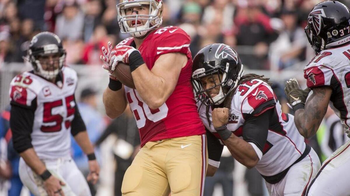 San Francisco 49ers tight end Garrett Celek (88) makes a 11 yard touchdown catch Atlanta Falcons cornerback Jalen Collins (32) defends in the second quarter in Sunday afternoons NFL football game between the San Francisco 49ers and Atlanta Falcons at Levi Stadium in Santa Clara on November 11, 2015.