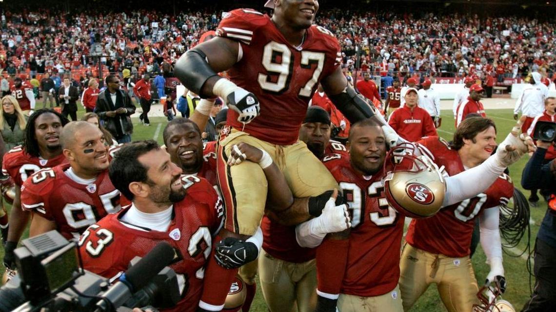 San Francisco 49ers defensive end Bryant Young (97) is carried off the field by teammates after his team's win over the Tampa Bay Buccaneers in an NFL football game in San Francisco, Sunday, Dec. 23, 2007. San Francisco won 21-19. Young plans to retire at the end of the season.