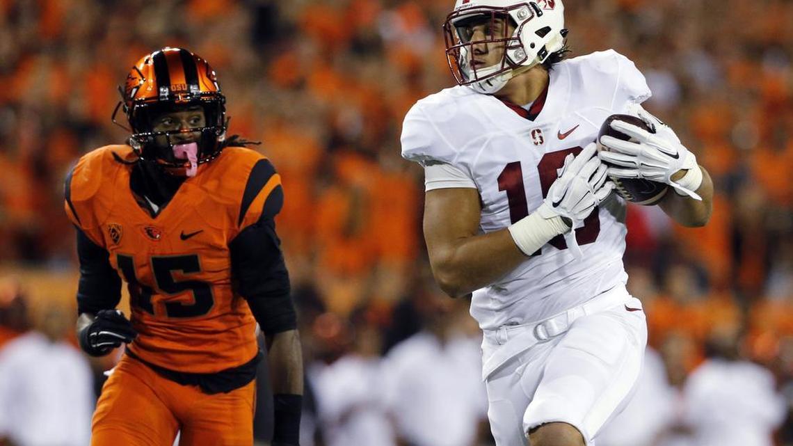 Stanford's Austin Hooper, right, catches a touchdown pass as Oregon State's Larry Scott trails during the first half of an NCAA college football game in Corvallis, Ore., Friday, Sept. 25, 2015.