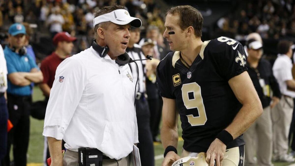 New Orleans Saints head coach Sean Payton, conferring with quarterback Drew Brees (9) during a game on Dec. 27, 2015, says, “I don’t envision myself coaching for any other club” than the Saints.