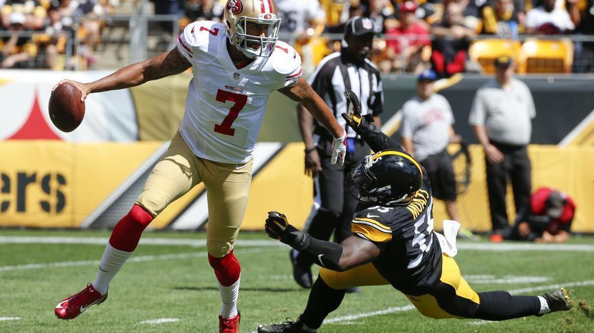 
San Francisco 49ers quarterback Colin Kaepernick (7) scrambles to pass after evading Pittsburgh Steelers outside linebacker Arthur Moats (55) in the first quarter of an NFL football game, Sunday, Sept. 20, 2015 in Pittsburgh. 
