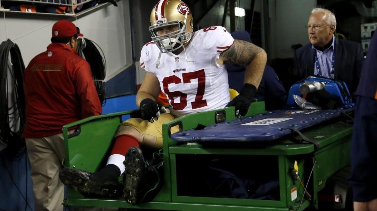 San Francisco 49ers center Daniel Kilgore is carted off the field after being injured against the Denver Broncos during the first half of an NFL football game, Sunday, Oct. 19, 2014, in Denver.