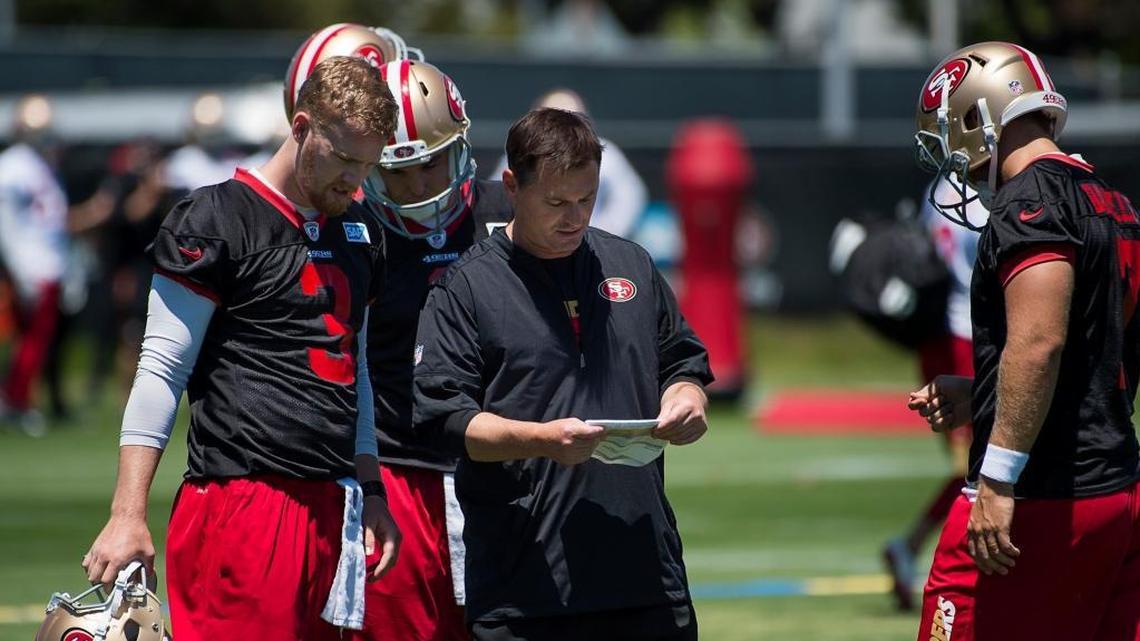 Quarterbacks coach Rich Scangarello works with C.J. Beathard during the 49ers practice at Levi’s Stadium on Tuesday in Santa Clara.