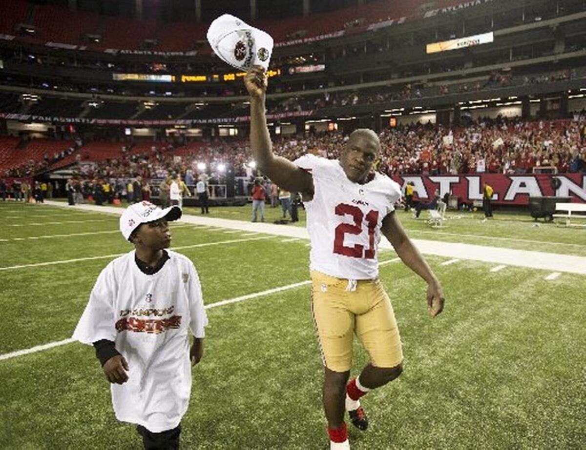 Frank Gore waves to fans after his last game with the team in the 2014 season.