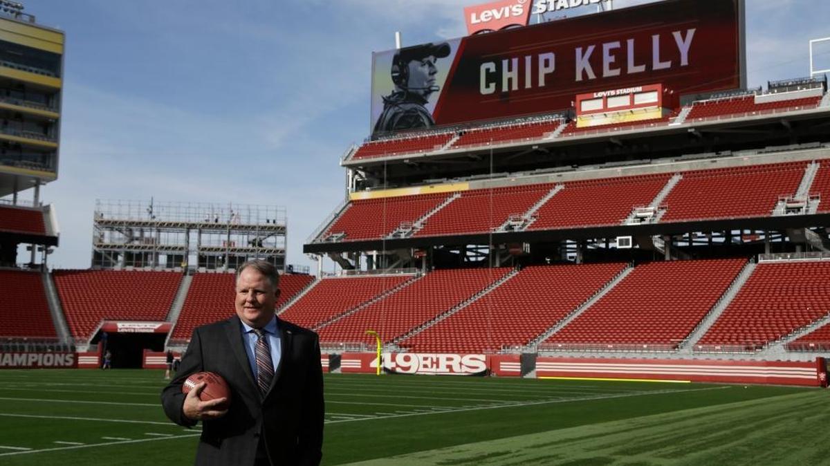 San Francisco 49ers coach Chip Kelly holds a football on the field at Levi Stadium Wednesday, Jan. 20, 2016, in Santa Clara, Calif.